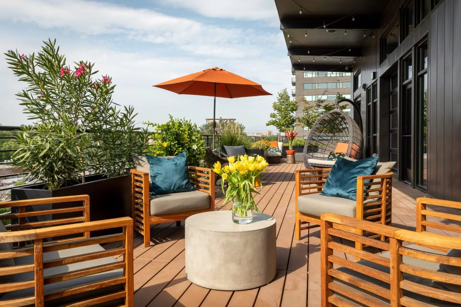 Sunny rooftop patio with modern lounge seating at Shift Workspaces Denver and Shift Workspaces Littleton.