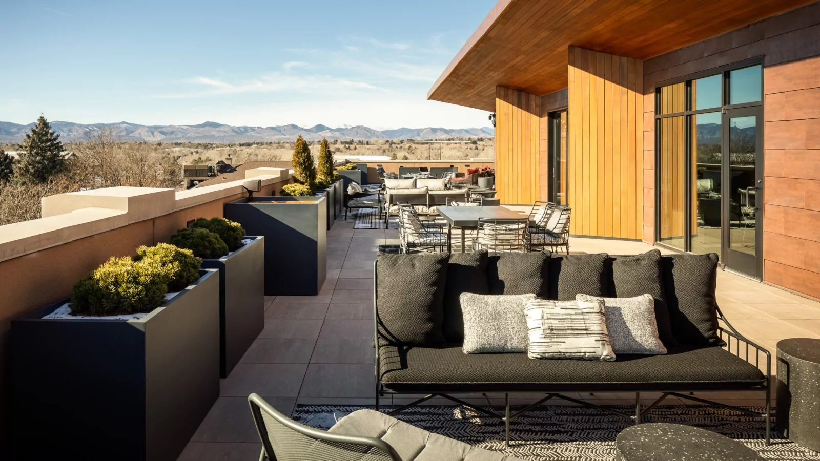 Shift Workspaces Littleton outdoor lounge area with modern decor and cozy seating