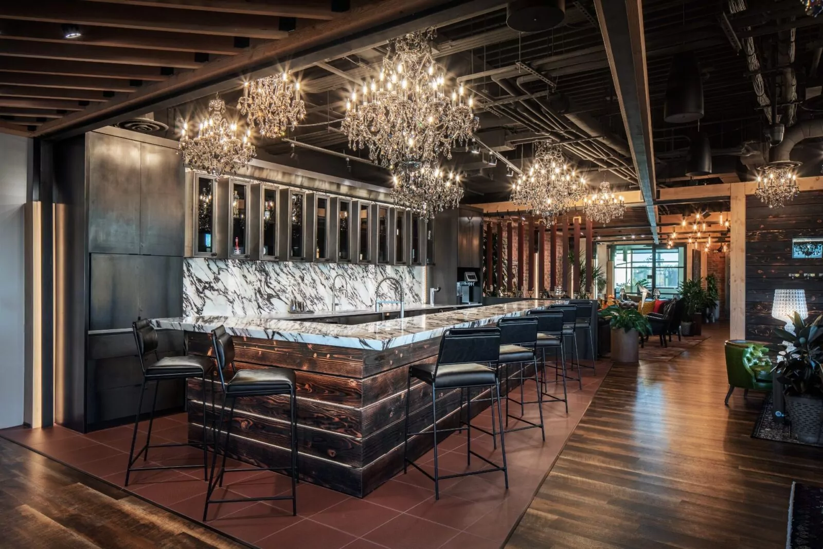 Sleek modern bar at Shift Workspaces with stylish lighting, elegant countertops, and a sophisticated ambiance