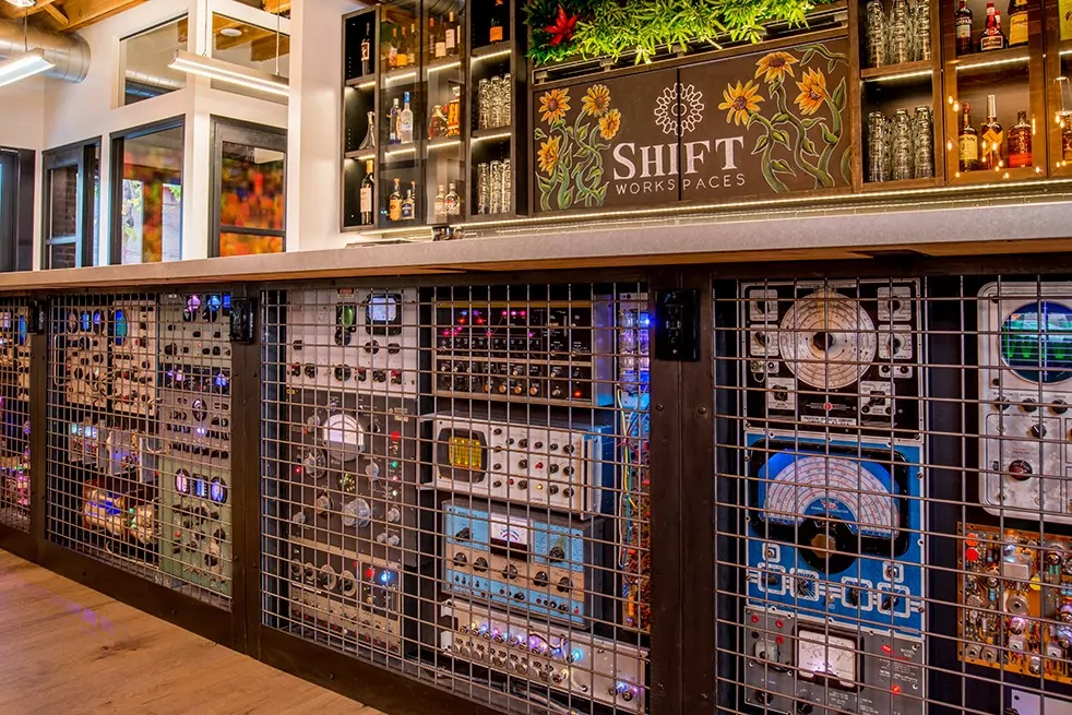Bar casing adorned with restored electronics recovered from Fistell's Electronics at Shift Workspaces Bannock