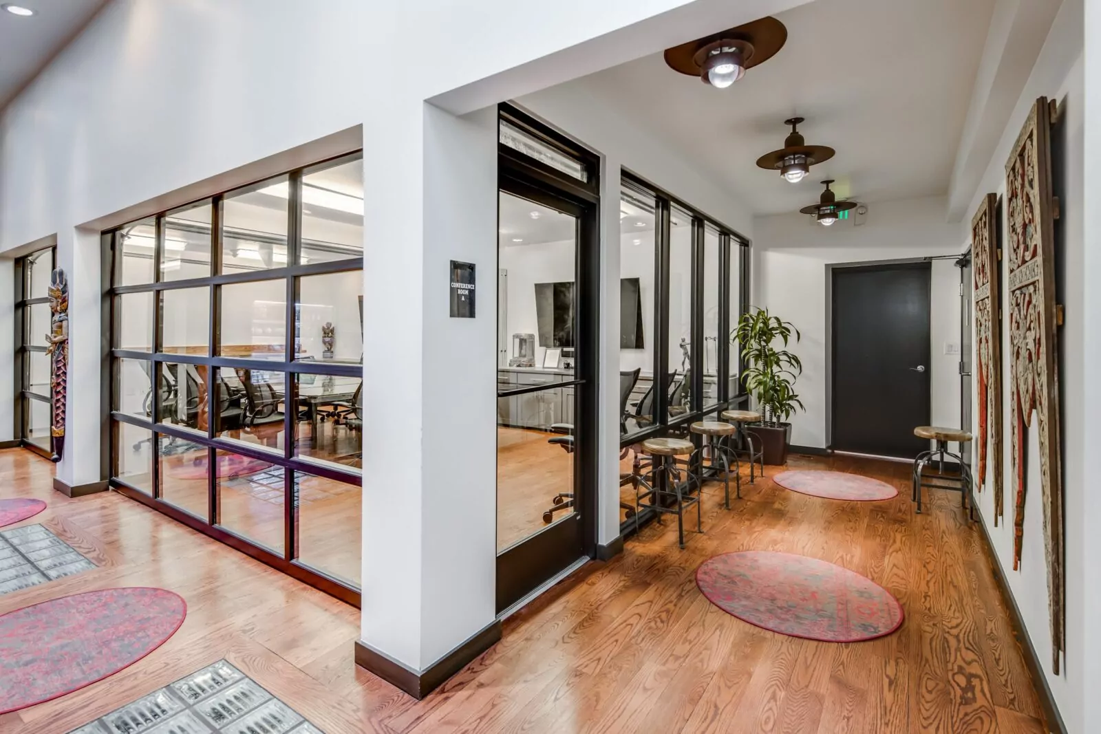 Bright corner conference room at Shift Workspaces Corona with a large table, ergonomic chairs, and floor-to-ceiling windows for natural light.