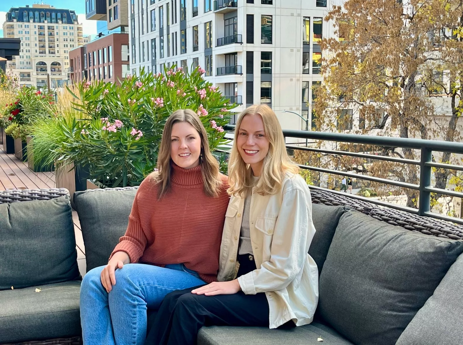 Team members from Sweep smiling on the outdoor terrace at Shift Workspaces Denver and Shift Workspaces Littleton.