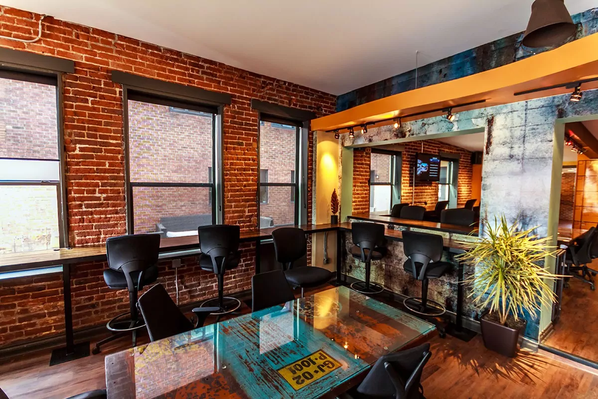 Cozy workspace with exposed brick at Shift Workspaces in Denver and Littleton