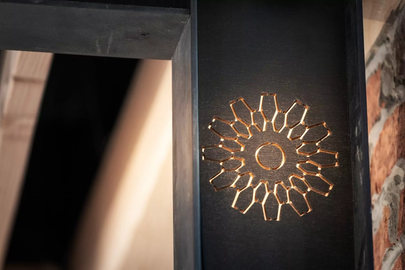 Close-up of decorative lighting with geometric cutout design at Shift Workspaces Denver and Shift Workspaces Littleton