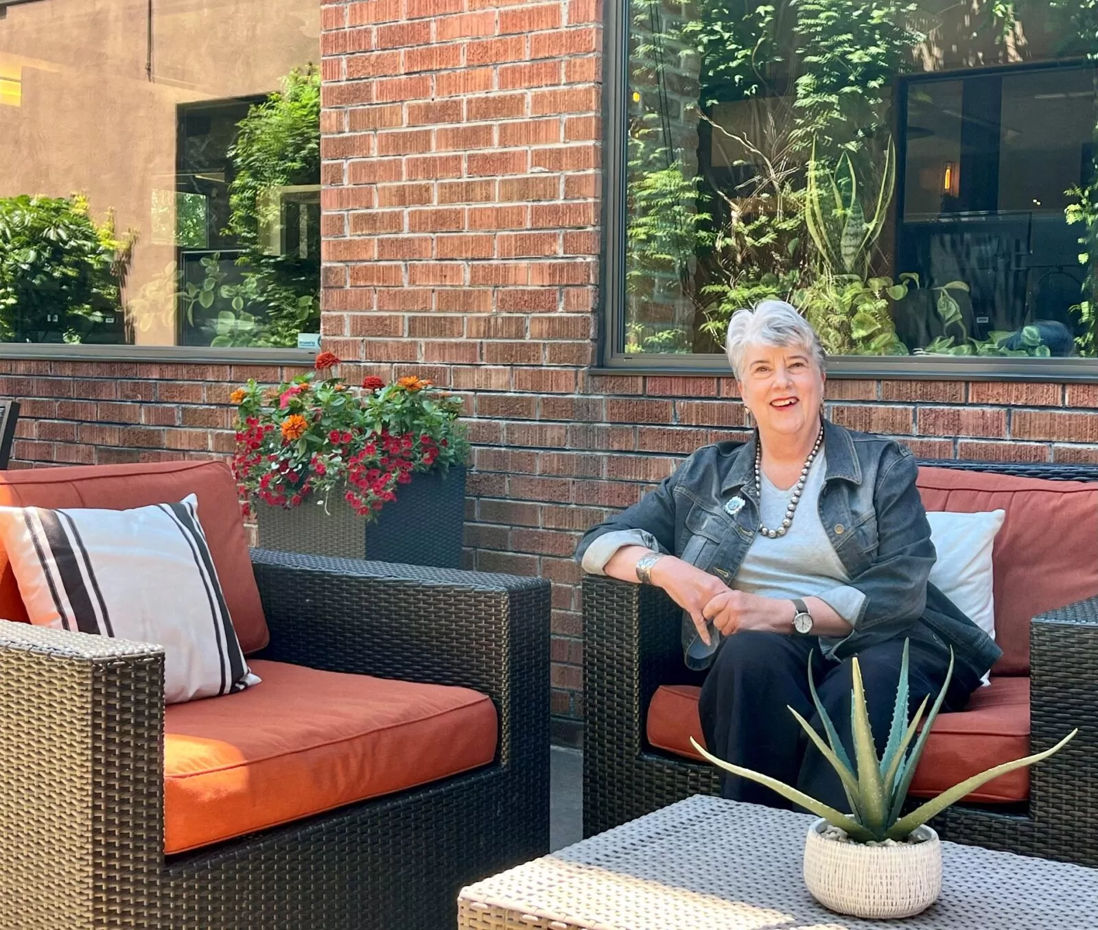 Raylene Decatur seated on the patio at Shift Workspaces Denver and Shift Workspaces Littleton