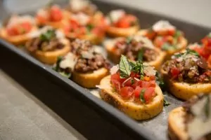 Close-up of gourmet bruschetta appetizers served at a Shift Workspaces Denver and Shift Workspaces Littleton event.