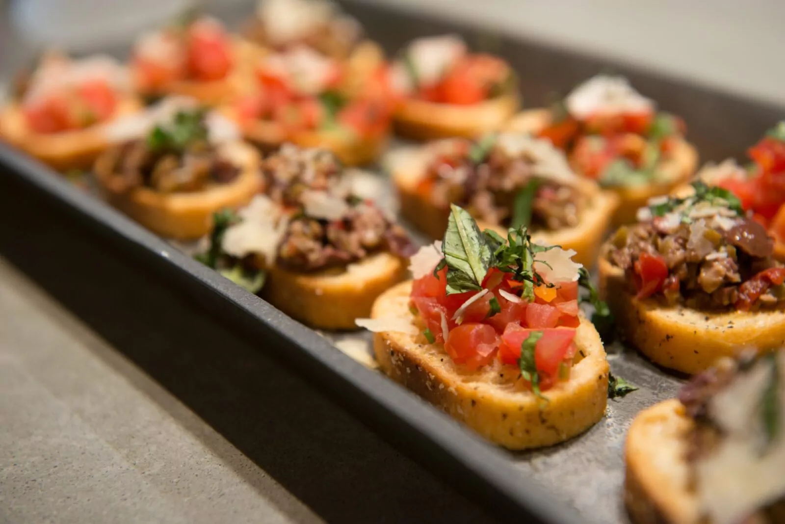 Close-up of gourmet bruschetta appetizers served at a Shift Workspaces Denver and Shift Workspaces Littleton event.