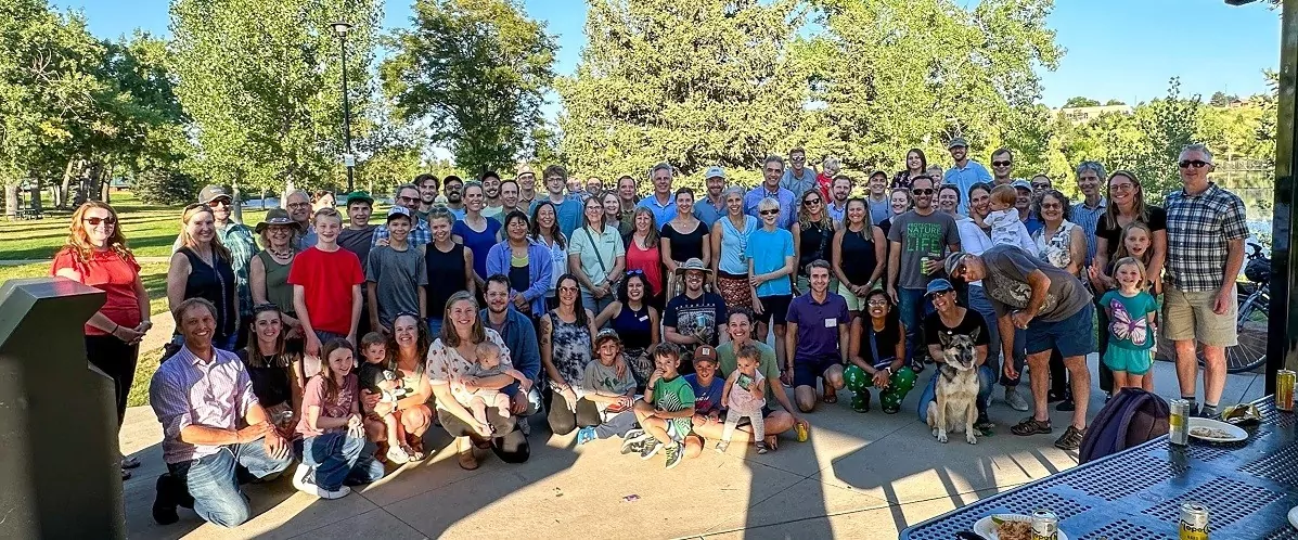 Group photo of The Nature Conservancy team enjoying a sunny outdoor gathering at Shift Workspaces Denver and Shift Littleton.